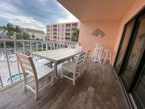 Dining table with bench and four chairs along with a high top 