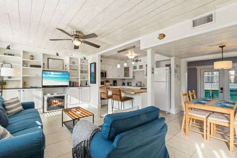 Living Room: Bright, airy space with beach vibes, perfect for relaxation or family fun!