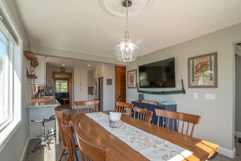 Seating for 8 at the dining table with 2 seats at the end of the counter. 