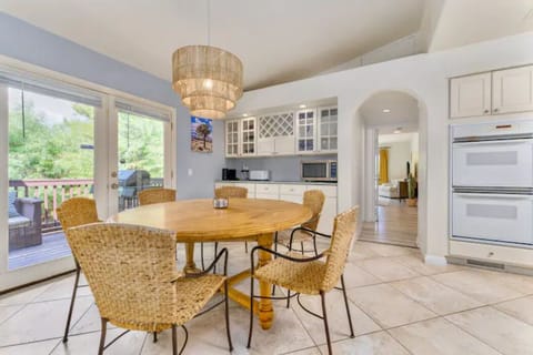 French doors leading out to patio with grill