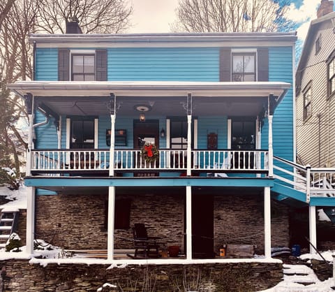 Blue portion of house is the rented portion; front door off of porch