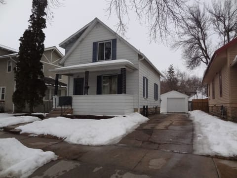 Front of house, driveway and single car garage