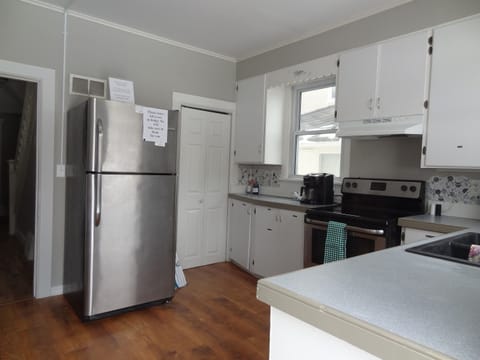 Kitchen with stove and refrigerator