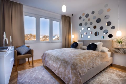 Cozy bedroom overlooking beautiful natural scenery.