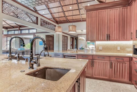 Chef's kitchen with state of the art WOLF appliances and Miele coffee machine