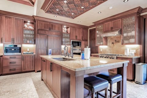 Chef's kitchen with state of the art WOLF appliances and Miele coffee machine