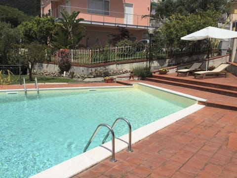 Water, Plant, Building, Swimming Pool, Azure, Window, Tree, Chair, Body Of Water, Outdoor Furniture