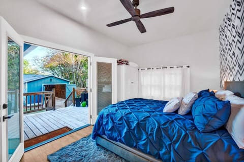 Bedroom 2 sleek and modern chic bed room with access to 2nd luxury bathroom. French doors lead you to the back porch and amazing yard