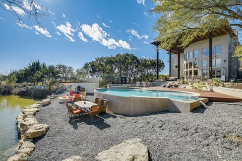 Beautiful hill country home with heated pool, spa, fire pit and spring fed pond! Endless Pool swim jet for exercise and recreation!
