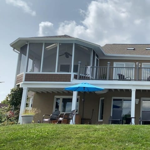 Photo from the waterfront. Porch, Deck, Patio all face the water. 
