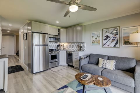 Main Living Area - The main living area in this condo with all brand new furnishings include the all stainless and granite kitchen, wood grain tile floors and new wood cabinets. The living room area has a new sofa w/queen sleeper. The room opens to the balcony overlooking the ocean.