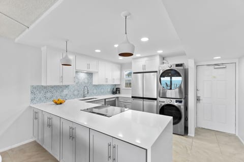 Whip up a dinner in this sleek, fully equipped kitchen while chatting with loved ones at the breakfast bar.