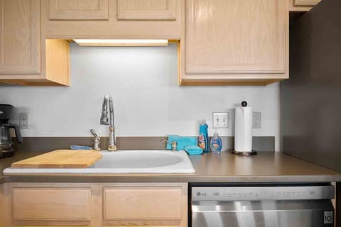 Kitchen also equipped with basic cleaning supplies to make celaning up easy