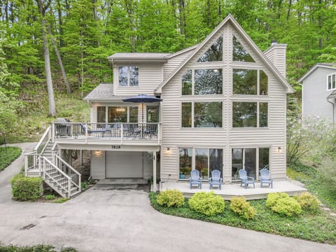 Front View of Home with gorgeous windows overlooking the lake.  