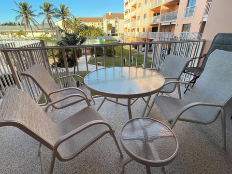 Seating for six on the balcony--2 elevated chairs and table not fully pictured.