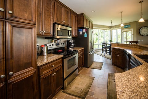 Fully supplied kitchen including a single-serve or 12-cup coffee maker.