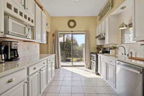 View of the kitchen with sliding doors to the balcony. 