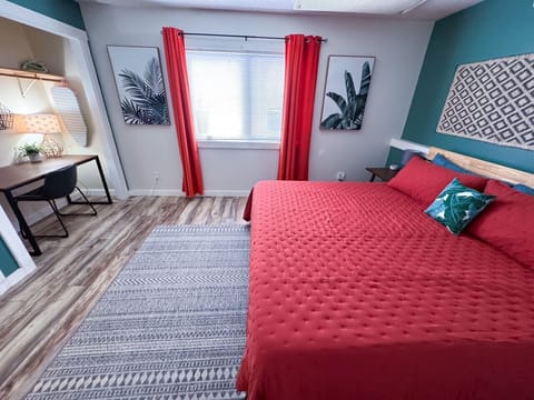 Bedroom #1 with King bed and desk area.
