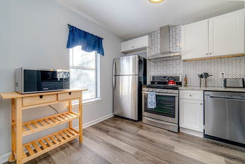 Kitchen includes refrigerator, oven/stove, dishwasher, and a brand new microwave