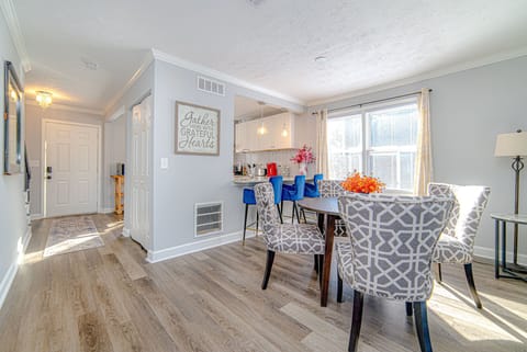 Dining area, kitchen, and front door view from the living room.