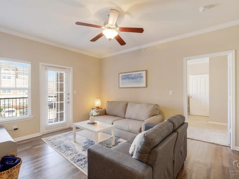 Living area with Queen Sleeper Sofa, SMART TV,  and balcony