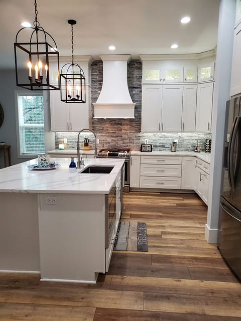 Custom kitchen with gas stove and Samsung appliance, Quartz countertops