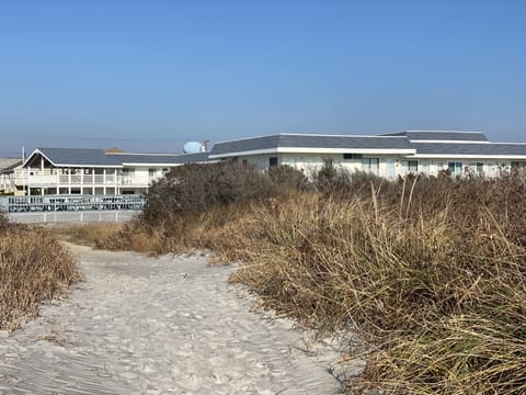 One of 2 path ways leading to the beach on either side of the complex