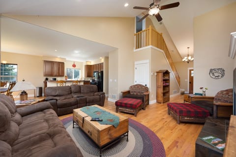 Living room and kitchen, stairs to upstairs hall