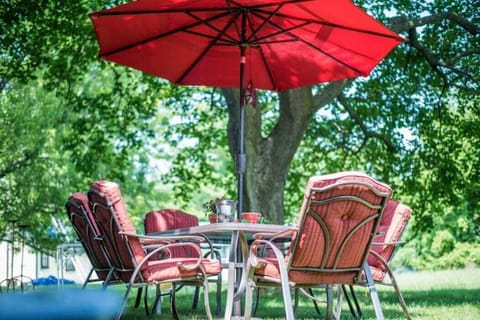 Communal outdoor seating area in large backyard