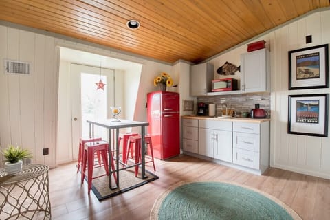 Kitchenette with refrigerator, microwave and drip coffee maker (no stove).
