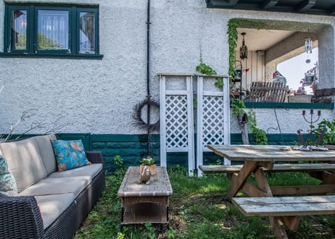 Additional outdoor entertaining space in side yard and large front porch