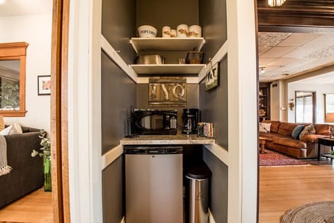 Downstairs kitchenette nook with microwave, toaster, coffee maker, mini fridge/freezer. No stove/sink