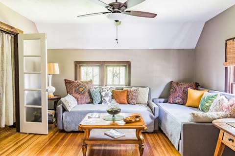 Two twin daybeds in living room area
