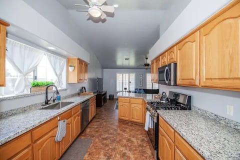 Kitchen with stainless steel appliances, dishwasher, microwave, gas stove