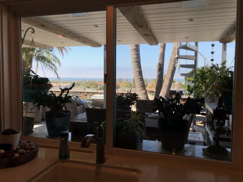 Covered patio with dining area and ocean views!