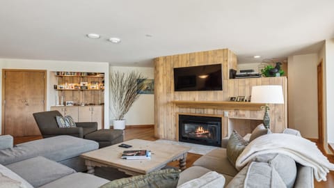 Sink into plush couches by your personal fireplace, with modern touches and thoughtful design inviting you to unwind in total comfort.
