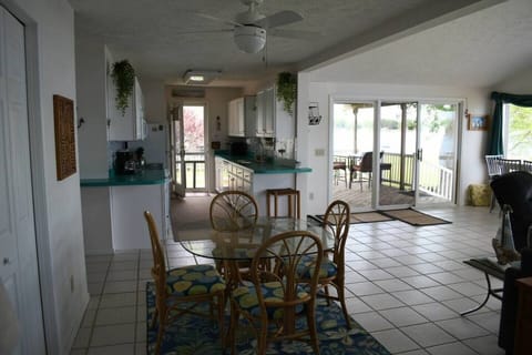 4 seater dining table. Other dining table located at front windows.