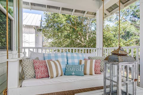 Private balcony, complete with a charming porch swing