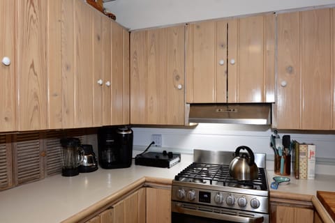 Located just to the left of the dining room, the kitchen is well equipped with new appliances and other accoutrements.