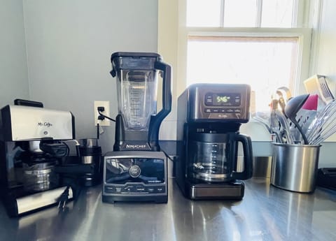 Some of the appliances for use in the kitchen. On the left is an espresso maker