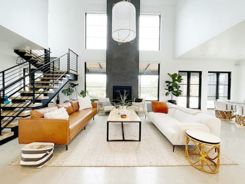 living space with floor to ceiling windows and fireplace