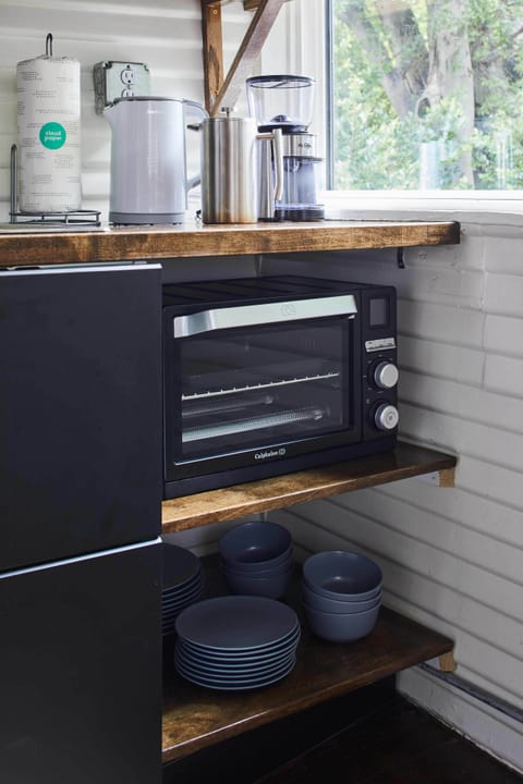 This kitchen has a convection toaster over, prefect for reheating a meal, baking a small batch of cookies or a pizza.