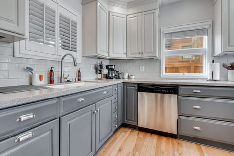 Your fully-equipped kitchen features granite countertops, stainless steel appliances, and ample storage for preparing meals during your stay.