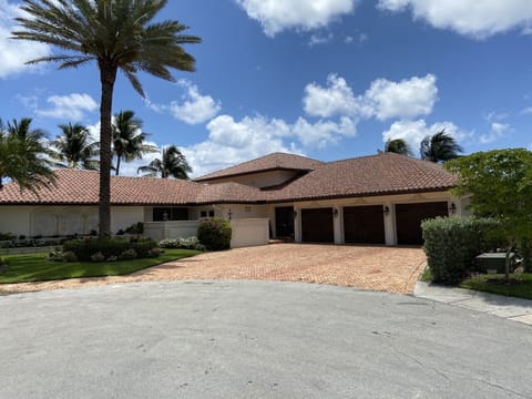 Street view with 3 car garage.