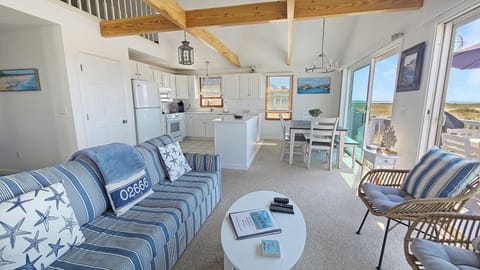 Open and bright main living area with vaulted ceiling