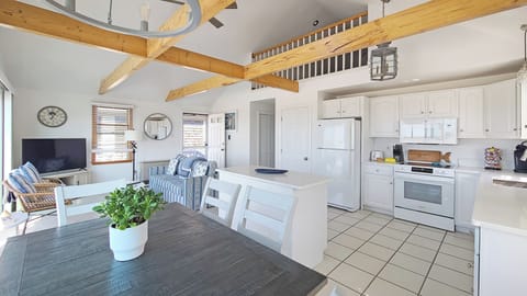 Main living area is open and bright with vaulted ceiling