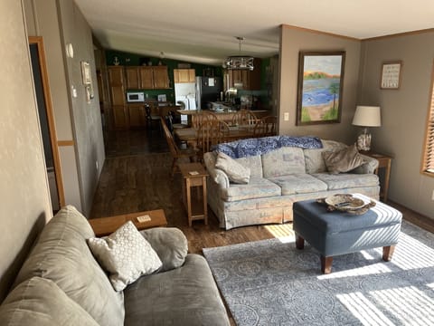 lake side living TV/ room, dining area and kitchen