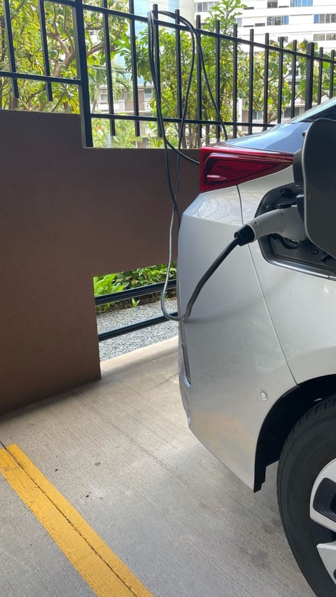Parking stall with an EV charging outlet
