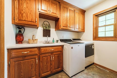 First floor laundry room equipped with washer & dryer