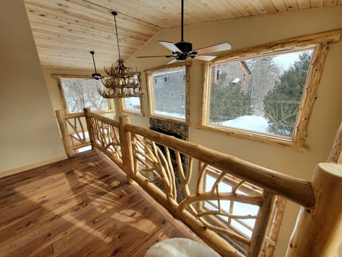 Adirondack style loft overlooking living rm